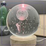 گوی شیشه ای نردبان و ماه و فضانورد قرمز روشن