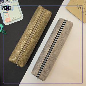 جامدادی چرم مصنوعی باریک تک زیپ کرم رنگ طرح دار